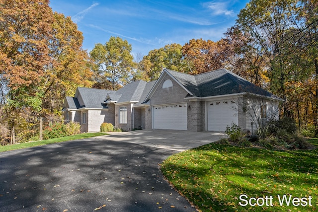 view of front of home featuring a garage and a front yard