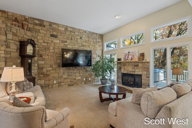 carpeted living room featuring a fireplace