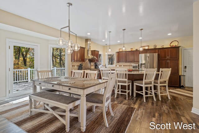 dining area featuring dark wood-type flooring