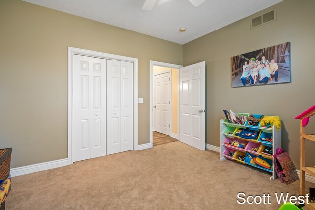 rec room featuring light colored carpet and ceiling fan