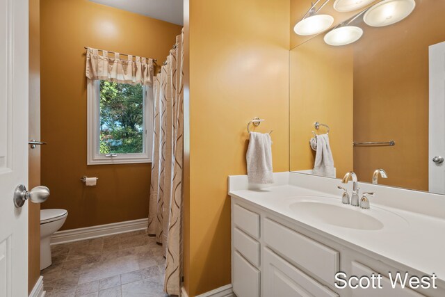 bathroom with vanity and toilet