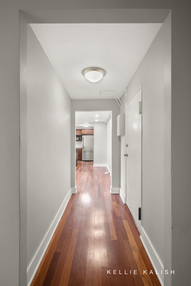 corridor featuring dark wood-type flooring