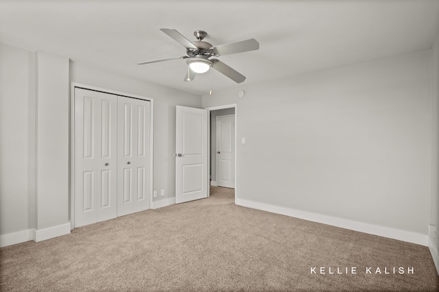 unfurnished bedroom featuring a closet, ceiling fan, and carpet floors