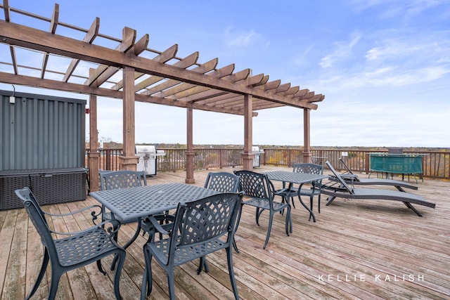 deck with a pergola and area for grilling