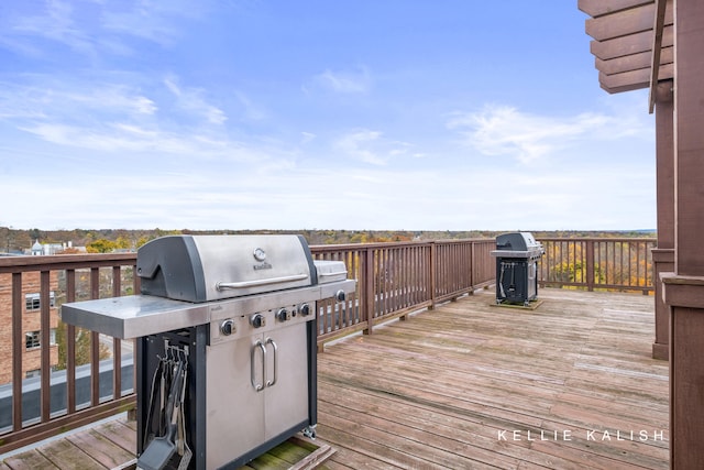 wooden deck featuring grilling area