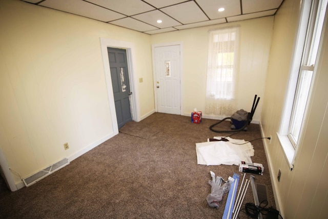 miscellaneous room with carpet floors and a drop ceiling