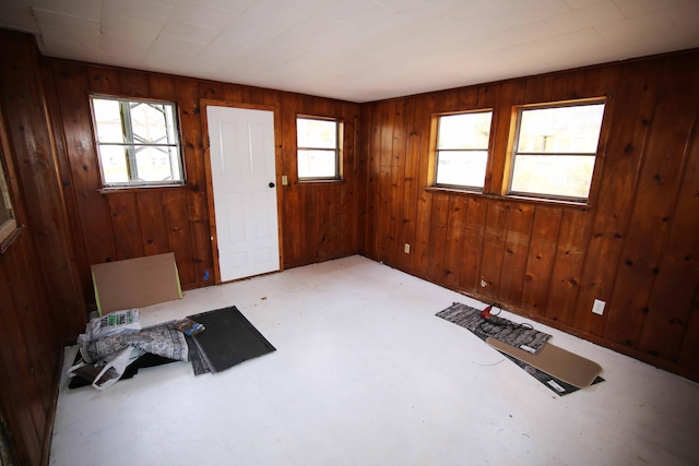 entrance foyer featuring wood walls