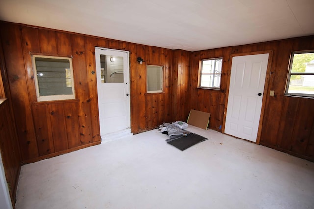 entryway with wooden walls