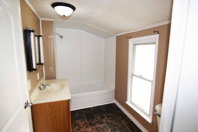 full bathroom featuring toilet, vanity, washtub / shower combination, and a wealth of natural light