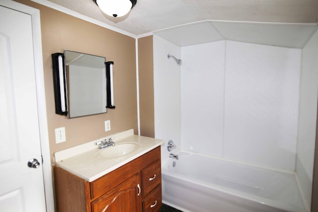 bathroom featuring vanity, crown molding, a textured ceiling, and shower / bathtub combination