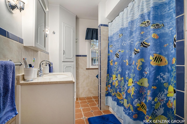 4102 Highgate Rd, Norton Shores, MI 49441 - bathroom featuring tile walls, vanity, tile patterned flooring, and a shower with shower curtain