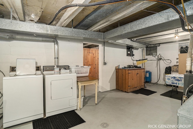 4102 Highgate Rd, Norton Shores, MI 49441 - unfinished basement with washer and clothes dryer and a water pressure tank