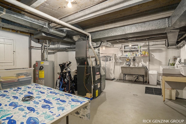 4102 Highgate Rd, Norton Shores, MI 49441 - unfinished basement with water heater, washer and clothes dryer, heating unit, and a sink