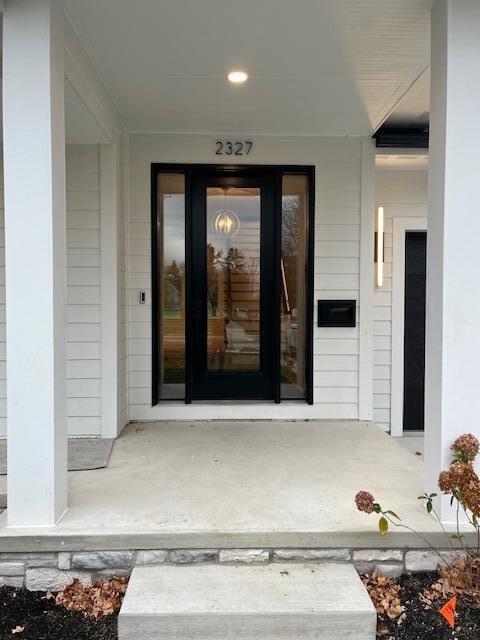 entrance to property with covered porch