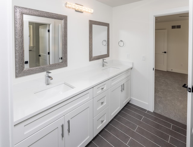 bathroom with vanity and tile patterned floors