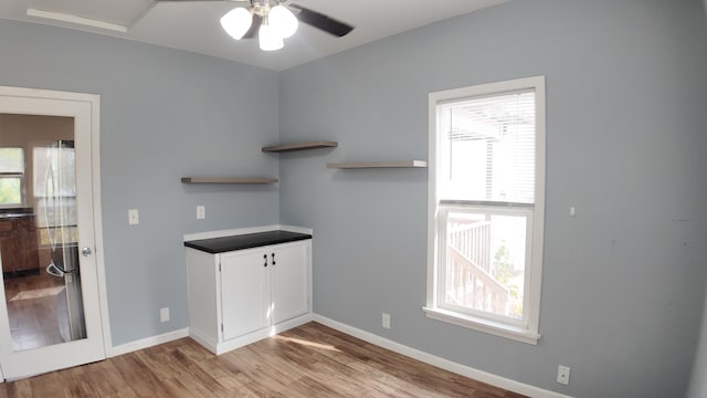 interior space featuring light hardwood / wood-style flooring and ceiling fan