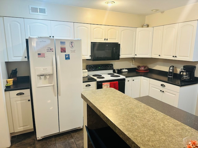 kitchen featuring white appliances and white cabinetry