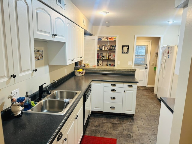 kitchen with sink, white refrigerator with ice dispenser, kitchen peninsula, white cabinetry, and dishwashing machine