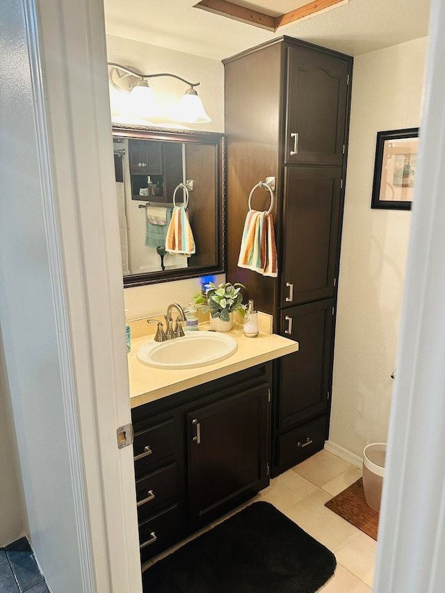 bathroom with vanity and tile patterned floors