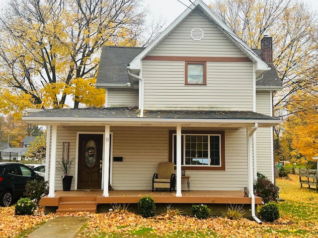 view of front property featuring covered porch