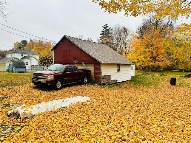 view of side of property featuring a garage