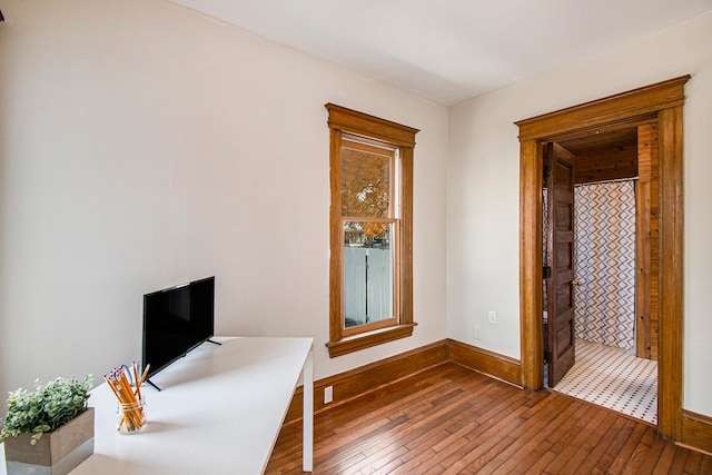 unfurnished office with wood-type flooring