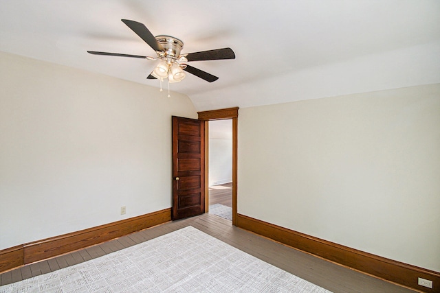 spare room with vaulted ceiling, light hardwood / wood-style flooring, and ceiling fan