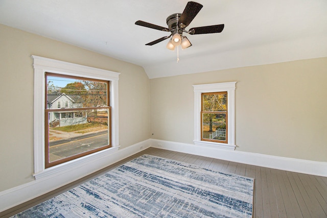 spare room featuring ceiling fan, wood-type flooring, and lofted ceiling