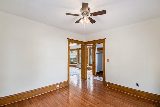 unfurnished room with ceiling fan and hardwood / wood-style flooring