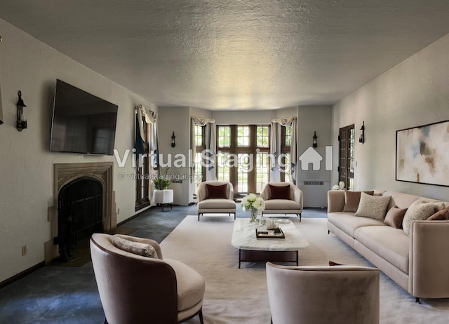 carpeted living room featuring a textured ceiling and radiator