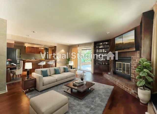 living room with dark hardwood / wood-style flooring and a fireplace