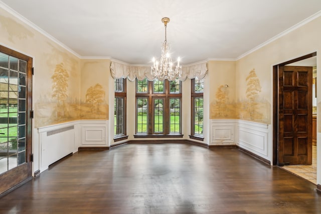 unfurnished dining area with ornamental molding, an inviting chandelier, and dark hardwood / wood-style flooring