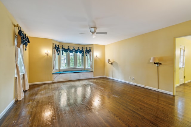 spare room with wood-type flooring and ceiling fan