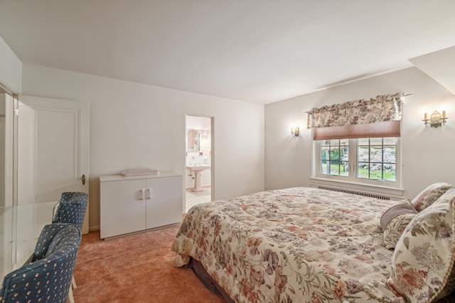 bedroom featuring carpet floors, ensuite bathroom, and radiator heating unit