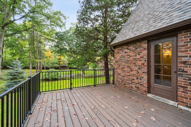 wooden terrace with a lawn