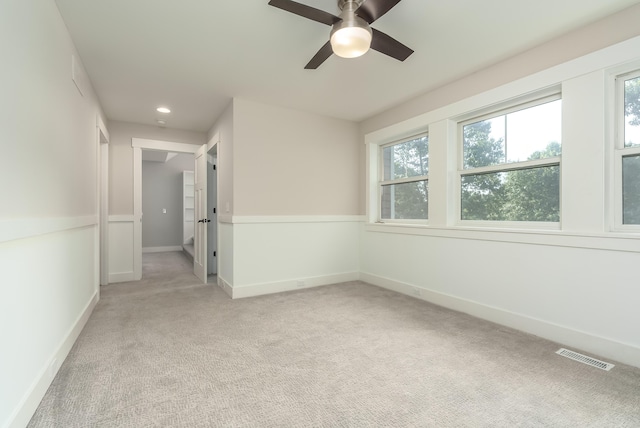 carpeted empty room with ceiling fan