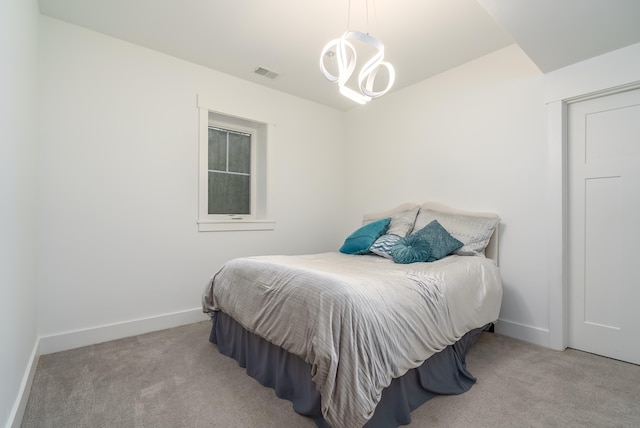 bedroom featuring light carpet