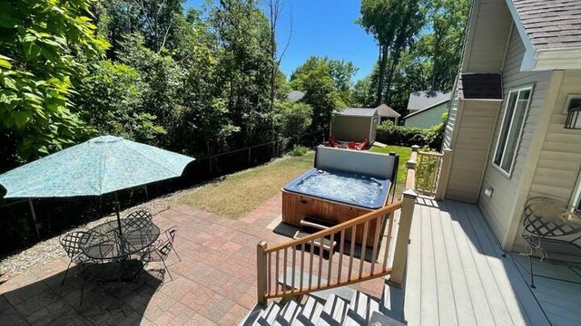 view of patio / terrace with a hot tub