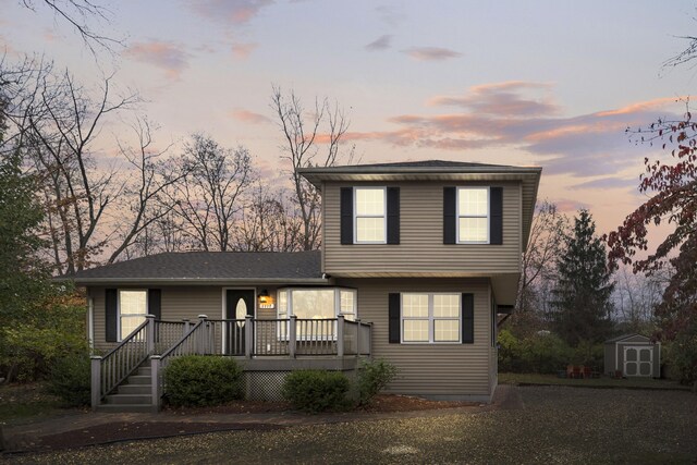 view of front of house with a shed