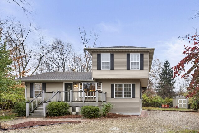 view of front of property with a storage unit