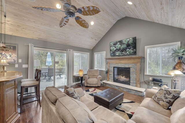 living room featuring a fireplace, hardwood / wood-style flooring, ceiling fan, and wooden ceiling