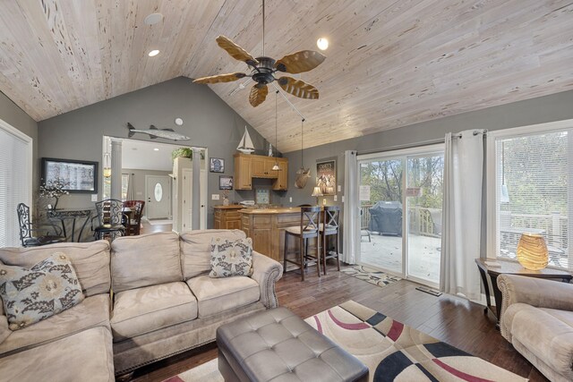 living room featuring ceiling fan, high vaulted ceiling, wood ceiling, and hardwood / wood-style flooring