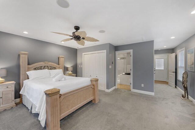 carpeted bedroom with ceiling fan, ensuite bathroom, and a closet