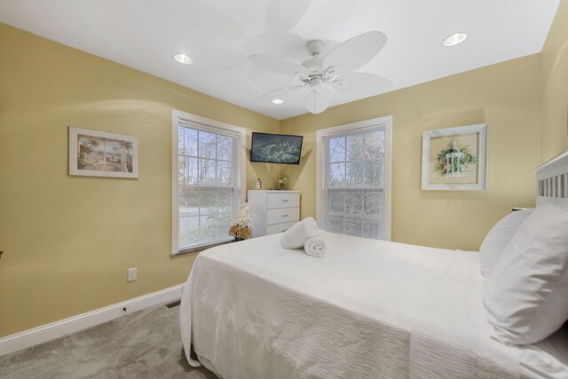 bedroom featuring ceiling fan and light carpet