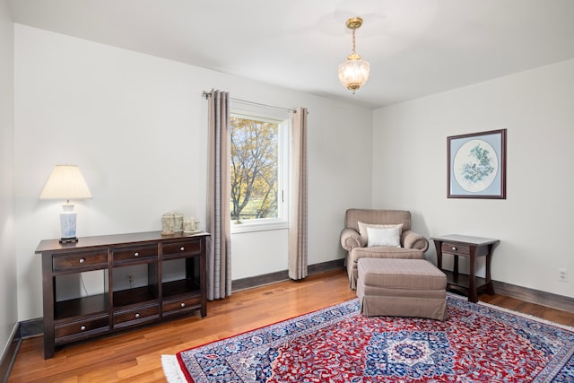 sitting room with light hardwood / wood-style flooring