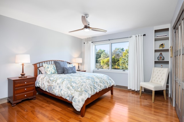 bedroom featuring a closet, hardwood / wood-style floors, and ceiling fan