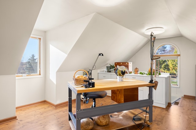 office area with lofted ceiling and light wood-type flooring