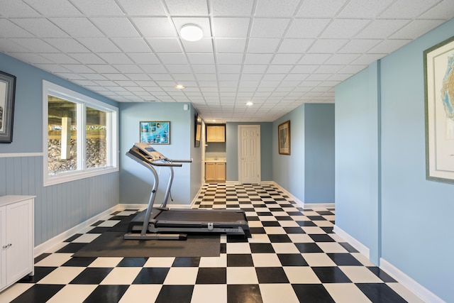 exercise room with a drop ceiling