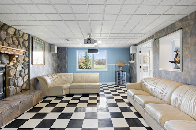 living room featuring a paneled ceiling