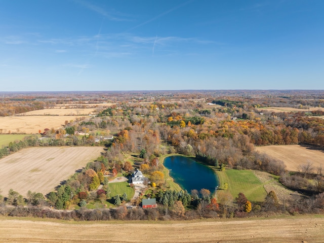 drone / aerial view with a water view and a rural view